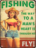Pin Up Girl Fishing Metal Tin Sign The Way to A Man's Heart Through His Fly Vintage Sign for Wall Art Decor for Home Angler Wall Decor Cafes Lake House Seascape Decor 12X16Inch